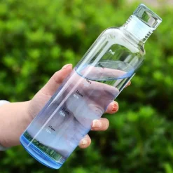 Hitzebeständige Glaswasserflasche - Stilvolles Zeitskalen-Design