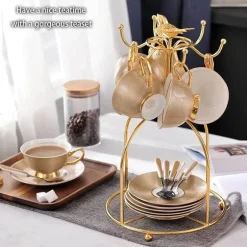Luxuriöses Teeservice aus Knochenporzellan mit Goldbesatz, Teekanne, Kaffeetassen und Milchkännchen