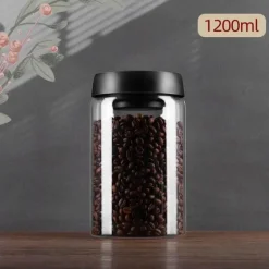 Vakuumversiegelter Kaffeebohnenbehälter aus Glas zur Frischhaltung in der Küche zu Hause